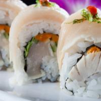 Albacore Delight  (1.2.) · Dungeness crab, avocado and cucumber topped with albacore, sliced red onions, and green onio...