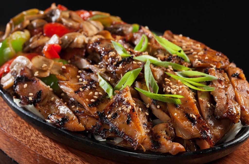 Chicken Bulgogi · Grilled marinated chicken over sauteed mushrooms, bell peppers, topped with green onions & sesame seeds