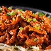 Spicy Pork Bulgogi · Grilled marinated spicy pork over sauteed mushrooms, bell peppers & onions, topped with gree...