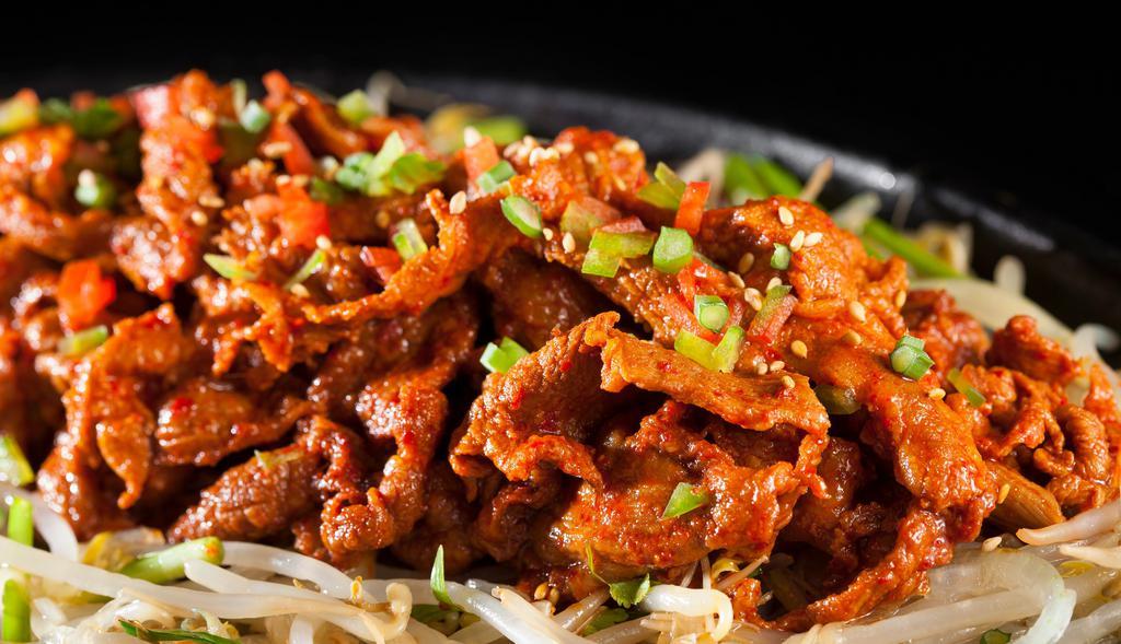 Spicy Pork Bulgogi · Grilled marinated spicy pork over sauteed mushrooms, bell peppers & onions, topped with green onions & sesame seeds