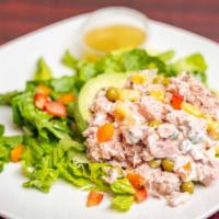 4. Palta Reina · Half avocado stuffed with chicken or tuna, corn, peas, red pepper, green pepper, carrot and ...