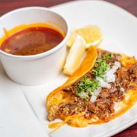 5. Quesobirria · Special shredded beef and melted cheese on a corn tortilla with consome.