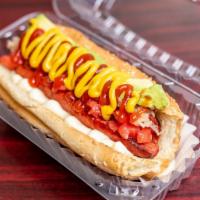 14. Chilean Hot Dog · Beef sausage, tomatoes, avocado, mayonnaise. Sourkraut, mustard and ketchup in a bun.