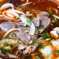 44. Bun Bo Nuong Cha Gio · BBQ beef and egg roll with vermicelli.