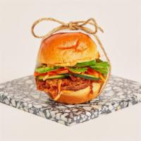 Bahn Mi Slider · Tender pulled pork with jalapenos, cucumber, cilantro, spicy mayo, and a shredded carrot sla...