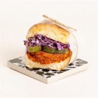 Nashville Hot Chicken Slider · Nashville-style hot fried chicken with coleslaw, pickles, and spicy mayo on a toasted bun.