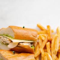 Titans · Grilled chicken, Swiss cheese, and pesto on baguette.