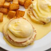 Egg Benedict · English muffin, poached eggs, hollandaise sauce, and your choice of Canadian bacon or veggies.