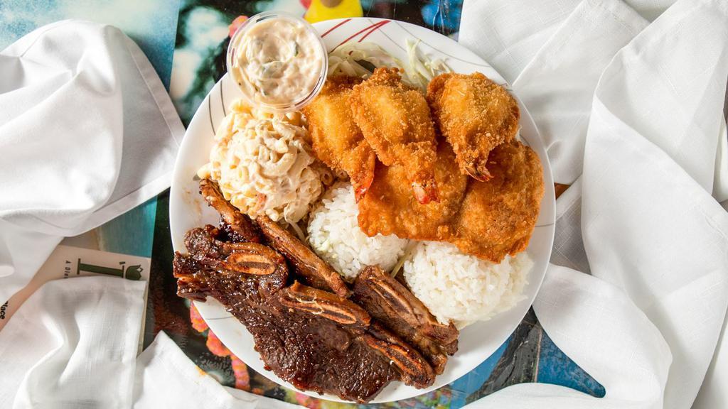 Seafood Combo · Fried Fish, Fried Shrimp and Choice of Meat. Served with 2 Scoops of Rice and Choice of Macaroni Salad or Tossed Green Salad.