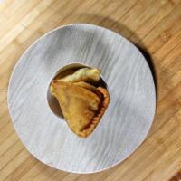 3. Samosa (5 Pieces) · Triangle flour wrap filled with potatoes, onions, and unique spices serve with house sauce.