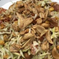 9. Ginger Salad · Pickled ginger, cabbage, lettuce, tomato, fried yellow beans, sunflower seeds, peanuts, and ...