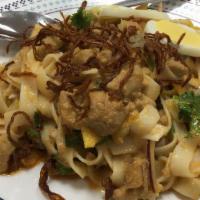 19. Nan Pya Dok · Flat wheat flour noodle mixed with coconut diced chicken sauce, bean powder, red onion, cila...