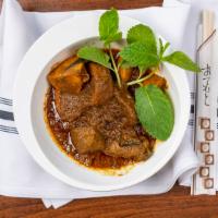 25. Beef Curry · Beef and potato cook with house special curry paste.