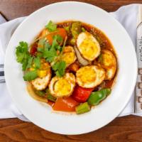 24. Okra Egg Curry · Okra and fried hard boil egg cook with green and red bell peppers, yellow onions and house s...