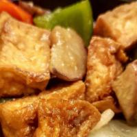 30. Tofu · Stir fry with light fry tofu, green onions, red, green peppers, and choice of green bean or ...