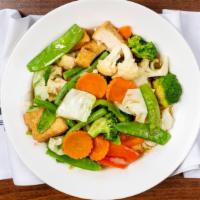 29. Fried Vegetables · Broccoli, snow peas, cabbage, cauliflower, carrot, mushroom, green bean, and soft tofu cook ...