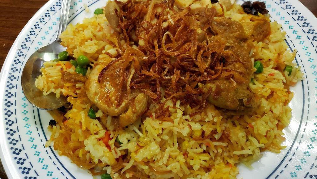 41. Chicken Biryani · Biryani rice come with house special chicken curry, cashews, raisin, and fried onion on top.