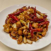 House Special Chicken · Hot and spicy. Tender chicken stir fried with onion, dry chili in house special spicy sauce.