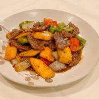 Mango Beef · Hot and spicy. Sliced beef with mango, onion, bell pepper and red bell pepper in hot garlic ...