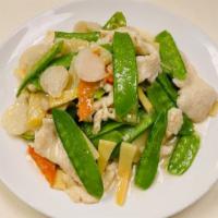 Chicken w/ Snow Peas · Sliced chicken with snow peas, bamboo shoot, water chestnut and carrot in garlic sauce.