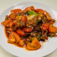Tomato Beef · Sliced beef with tomato, bell pepper, onion in tomato sauce.