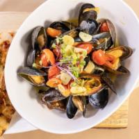 Steamed Mussels  · white wine, saffron, grape tomatoes, & sauteed leeks