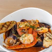 Cioppino · Dungeness crab, mussels, clams, shrimp, scallops, & fin Fish