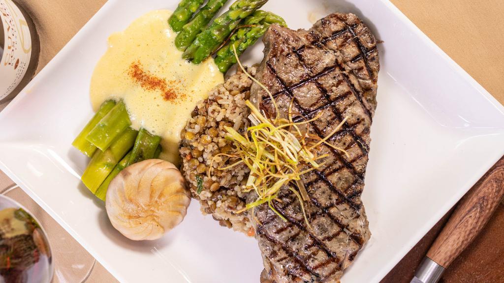 New York Steak · Served with sautéed asparagus & roasted  Yukon potatoes. Topped with herbed  compound  butter