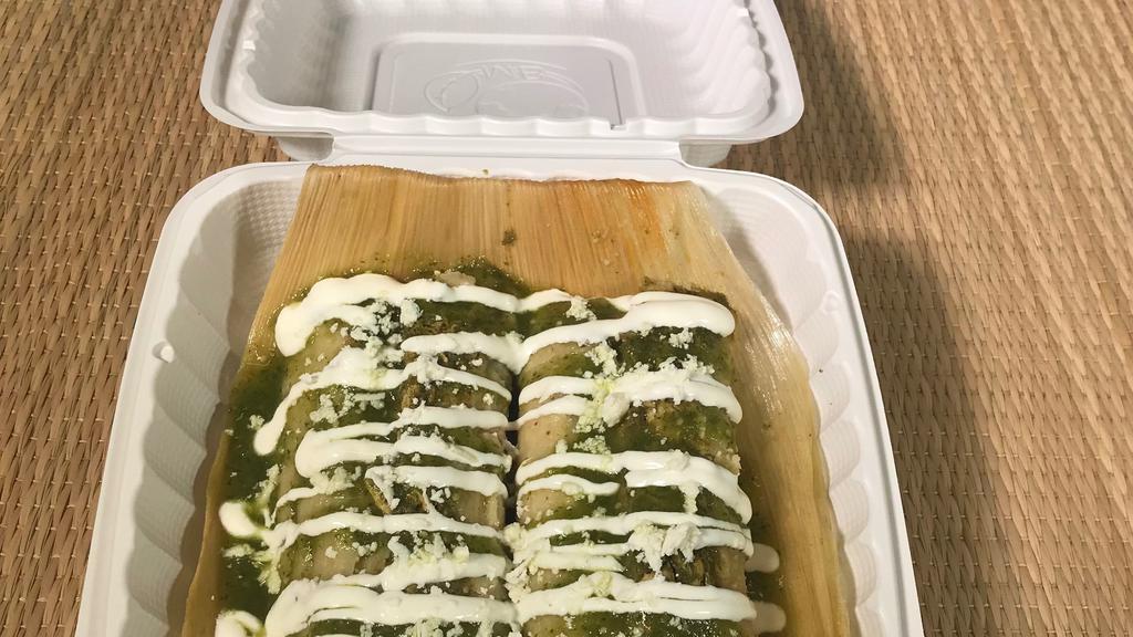 2 PIECE  GREEN SAUCE CHICKEN TAMALE  SPICY  · Savory corn masa mix with chicken in our roasted tomatillo and serrano pepper sauce. Wrapped in corn husks.  
Toppings  with your choice of  salsa verde mild or salsa roja spicy, sour cream and cotija cheese.