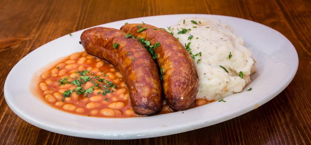 Irish Bangers and Mash · Two large juicy banger sausages with mashed potatoes, baked beans & gravy.