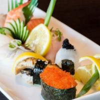 Nigiri Sushi Deluxe · 8 pcs of nigiri sushi, CA roll, and spicy tuna hand roll.