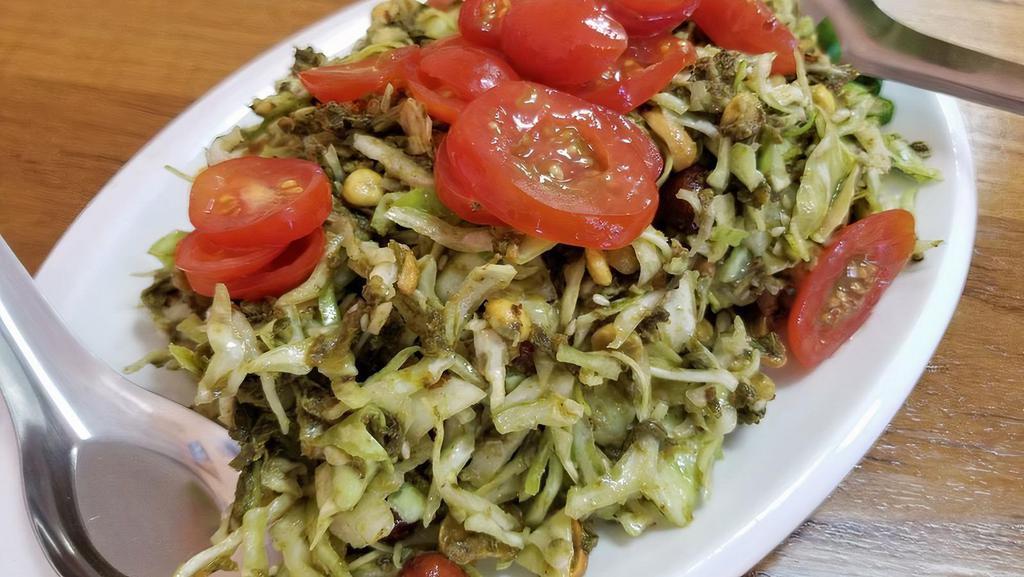 A5. Tea Leaf Salad · Fermented tea leaf, cabbage, tomato, chilli, dried shrimp, peanut, yellow bean, and sesame seed.