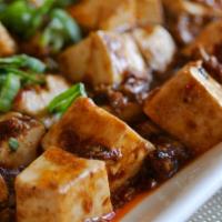 Ma Po Tofu 麻婆豆腐 · Cubed tofu with spicy mapo sauce. Vegetarian or with pork.