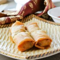 Egg Rolls (4 Pc)  春卷 · Made with cabbage, bean sprout, carrot, celery, and wood ear mushroom filling.