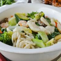 Seafood Noodle Soup 三鮮湯麵 · Made with fish fillet, calamari, shrimp, bok choy, broccoli, carrots, watercress, and shiita...