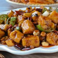 Kung Pao Tofu 宮保豆腐 · Sweet and spicy, with dried chili, scallions and peanuts.