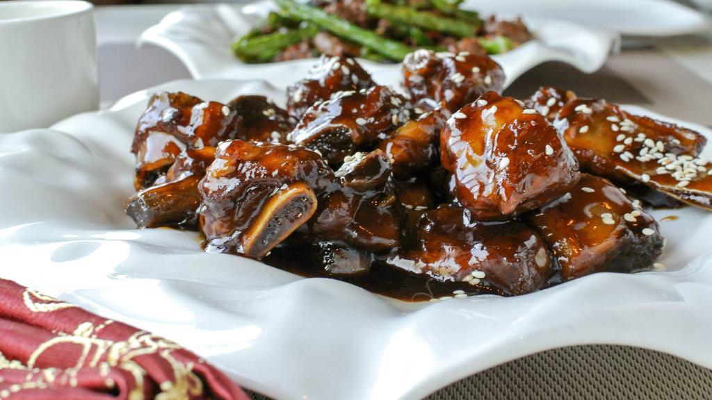 Beijing Style Sweet & Sour Sparerib 北京糖醋排骨 · Pork sparerib with a Beijing style dark sweet and sour sauce.
