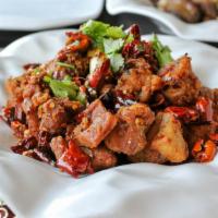 Chongqing Spicy Diced Chicken (with Red Chili) 重慶辣子雞 · Boneless diced chicken stir fried with dried red chili and Sichuan seasoning.