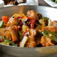 Hot and Spicy Dry-Cook Chicken 香辣乾鍋雞 · Chicken with bones, braised in a spicy chili sauce.