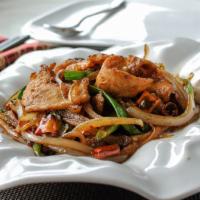 Mongolian Chicken 蒙古雞 · Sliced chicken with onion, dried chili, and scallions in a dark chili sauce.
