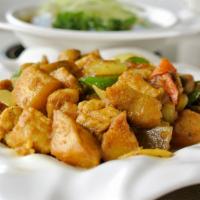 Curry Chicken 咖喱雞 · Chicken, potatoes and vegetables, stir fried with a yellow curry sauce. Gluten-free.