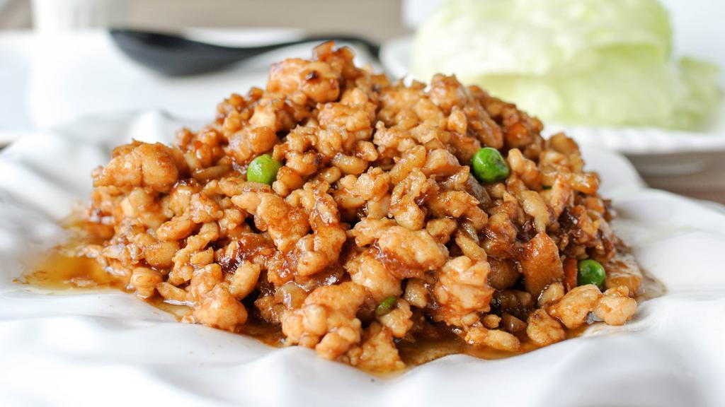 Minced Chicken with Lettuce Cup 生炒雞鬆 · Sweet and savory diced chicken and vegetables. Served with iceberg lettuce wraps.