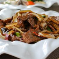 Mongolian Beef or Lamb 蒙古牛/蒙古羊 · Sliced beef, onions and scallions, in a spicy Mongolian sauce.
