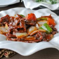 Tomato Braised Beef or Lamb 蕃茄牛/羊 · Beef,  onions, and bell pepper in a sweet and savory tomato sauce.