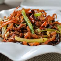 Dry-Cook Beef 干扁牛肉絲 · Fried beef, stir-fried in Sichuan seasoning and scallions. This dish is very spicy.