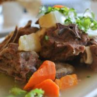 Private Kitchen Lamb 新疆手抓羊肉 · Lamb with bone, marinated and stewed with carrots and potatoes.