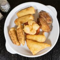 A11. Combination Appetizer · Two of Fried Prawns, Fried chicken wings, 
Crab Rangoon, Egg Rolls, potstickers.
