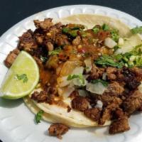 Regular Taco · Two soft corn tortillas, choice of meat, onions, cilantro and salsa fresca.
