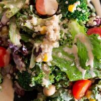 Jinya Quinoa Salad · Baby greens, kale, broccoli, white quinoa, kidney beans and garbanzo beans tossed with sesam...