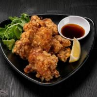 Crispy Chicken · Juicy fried chicken thigh with an original garlic pepper served with mixed baby greens and j...